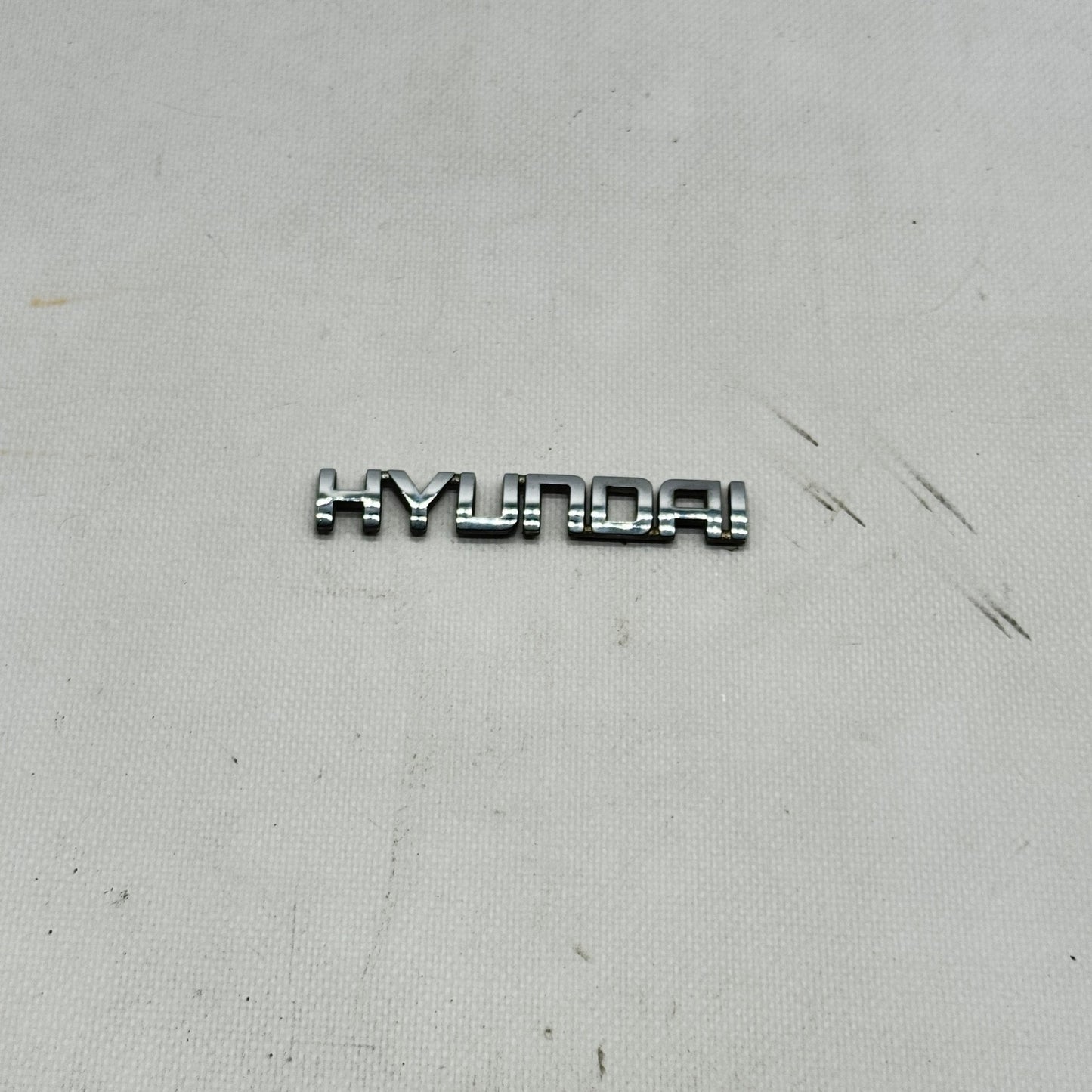 SCRITTA HYUNDAI LOGO EMBLEMA SIGA BADGE FREGIO ORIGINALE L-310